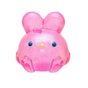 Close-up of a pink glitter bunny squishy toy for stress relief and sensory play.