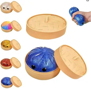 Set di squishy a forma di ravioli glitterati in cestini di vapore con vari colori e demo