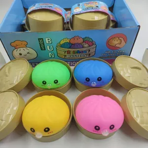 Set of colorful bun-shaped squishy fidget toys in mini steamer cases for stress relief