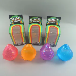 Juego de cuatro coloridos juguetes squishy de purpurina con caja de arcoíris