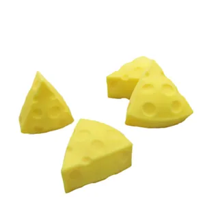 Set of four realistic yellow Swiss cheese squishy toys for stress relief