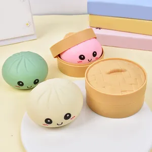 Close-up of cute emoji steamed bun squishies with miniature steamers for stress relief