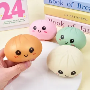 Set of four colorful smiling face steamed bun squishy toys for cute stress relief