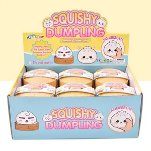 Full display box of squishy dumpling sensory fidget toys in steamer baskets