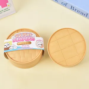 Detailed view of the squishy dumpling toy inside its mini steamer basket packaging