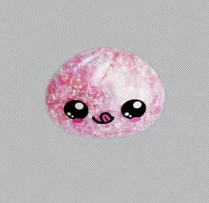 Close-up of pink glitter squishy toy with a cute cartoon smiley face detail.