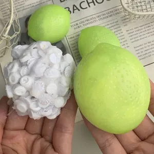 Macro detail of green and white textured lemon squeeze stress relief toy.
