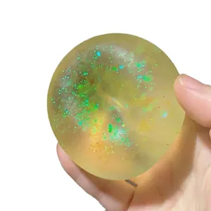 Transparenter Aurora-Malzzucker-Quetschball gegen Stress mit grünem Glitzer-Effekt