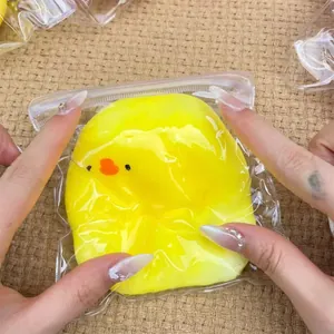 Detailed view of yellow duck squishy toy in clear bag for stress relief