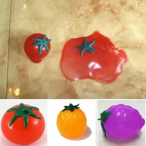 Red tomato squishy toy and fruit decompression ball for stress relief and venting.