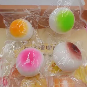 Colorful mochi squishy toy balls in individual plastic packaging for effective stress relief