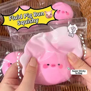 Close-up of a pink fluid piglet squishy toy being squeezed for effective stress relief