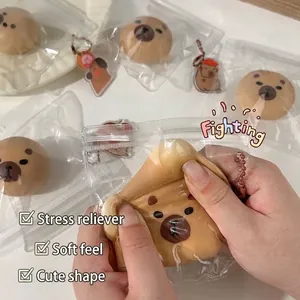 Cute cartoon capybara-shaped squishy stress relief toy being squeezed for sensory play