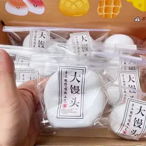 Close-up of white bun squishy toy in packaging for stress relief and slow rebound