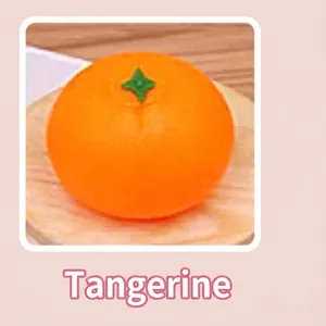 Detailed view of a soft, realistic tangerine-shaped squeeze toy for stress relief.