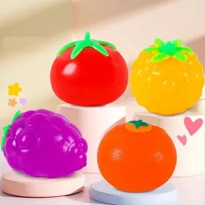Colorful fruit shaped squeeze toys including tomato and pineapple for stress relief