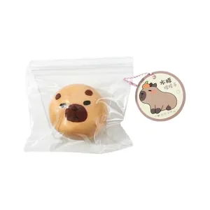 Simulation Capybara squishy stress relief toy in clear plastic packaging with round tag