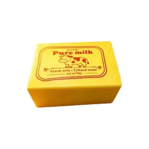 Stress relief butter squishy toy shaped like a yellow butter block with vintage milk label