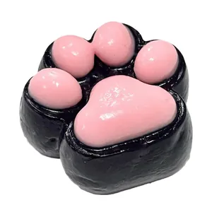 Slow rebound cat paw squishy toy in black and pink TPR material for stress relief