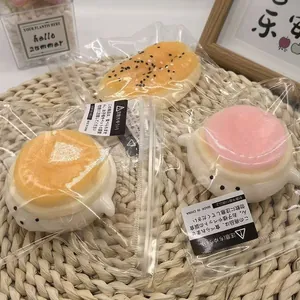 Set of cute dessert and bun shaped squishy decompression toys in transparent packaging