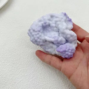 Close-up macro view of a pearl-textured squishy toy for stress relief in purple and white