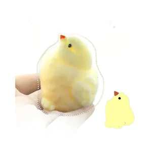 Adorable yellow plush chick squishy toy held in hand for sensory stress relief