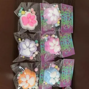 Set of six assorted colorful cat paw squishy toys in cute individual packaging for kids.
