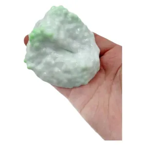Milky white pearl ice-skin squishy stress relief toy held in hand for sensory play