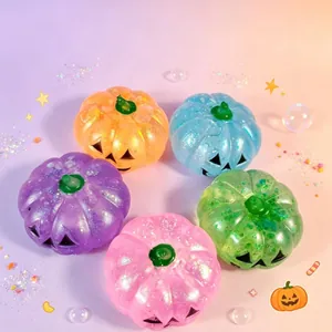 Close-up view of colorful glitter Halloween pumpkin squishy stress relief fidget toys