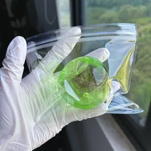 Green apple-shaped squishy toy inside a clear bag for effective stress relief and fun