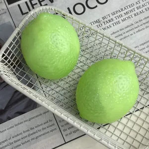 Detailed macro view of two green lime squeeze toys with realistic texture in a white basket