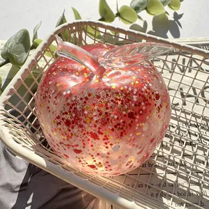 Detailed macro shot of a clear glitter-filled apple squishy stress relief toy.