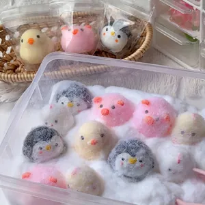 Detailed view of cute handmade animal squishy toys like chicks and penguins for stress relief