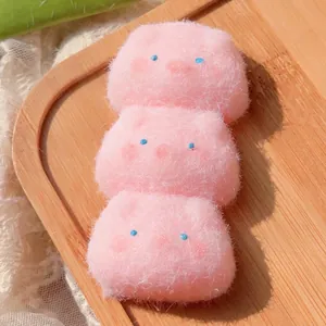 Detailed macro view of cute pink triple pig squishy toy with a soft and fuzzy flocked texture