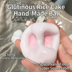 Jouet anti-stress mochi squishy fait main pressé par une main pour se détendre