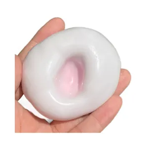 Jouet antistress mochi blanc souple avec centre rose et rebond lent pour détente
