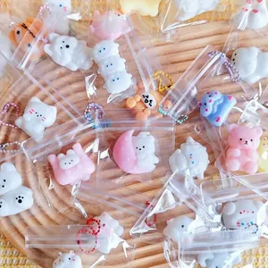 Detailed view of mini squishy animal keychains in individual packaging for stress relief