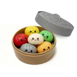 Colorful bun squishy fidget toy set with a mini plastic steamer basket for stress relief