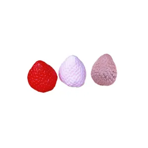 Three realistic strawberry-shaped squishy squeeze toys for stress relief in red and pink colors