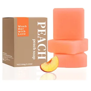 Detailansicht von Peach Yoni Bar handgemachten Seifenstücken neben braunem Karton