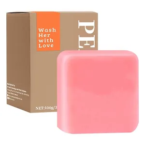 Nahaufnahme der rosa Pfirsich-Yoni-Bar-Handseife mit brauner Kartonverpackung