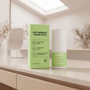 Green anti-wrinkle cream stick on a marble bathroom vanity with minimalist decor