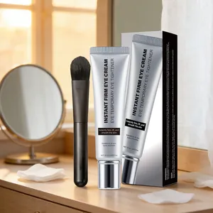 Detail of 20ml instant firming eye cream tube with brush and box on a vanity