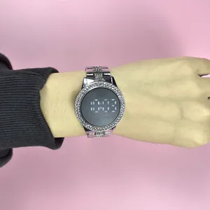 Detailed close-up of a silver rhinestone LED watch for women with a stylish steel band