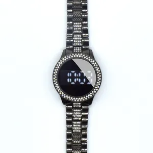 Detail of a black women's LED watch featuring a rhinestone bezel and metallic band.