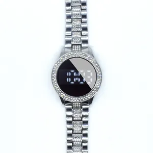 Detailed close-up of a luxury rhinestone-encrusted LED watch with silver steel link band.