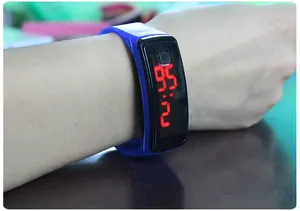 Close-up of blue silicone sports LED watch with red digital display on wrist