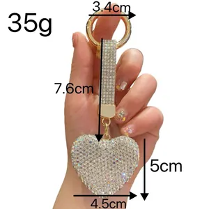 Detailed view of the rhinestone heart keychain showing exact dimensions and weight