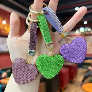 Detailed view of colorful heart-shaped keychains encrusted with sparkly rhinestones