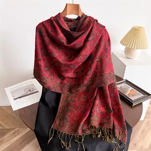 Detail view of red paisley pattern on elegant imitation cashmere tassel scarf
